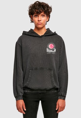 Sweat-shirt 'Sunset Charm' Merchcode en noir : devant