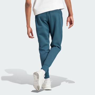 ADIDAS SPORTSWEAR Tapered Sportbroek 'Z.N.E. Premium' in Blauw