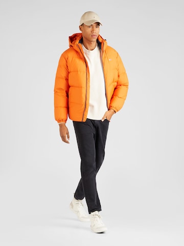 Tommy Jeans Zimska jakna 'ESSENTIAL' | oranžna barva