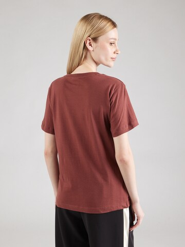 Maglietta di Champion Authentic Athletic Apparel in marrone