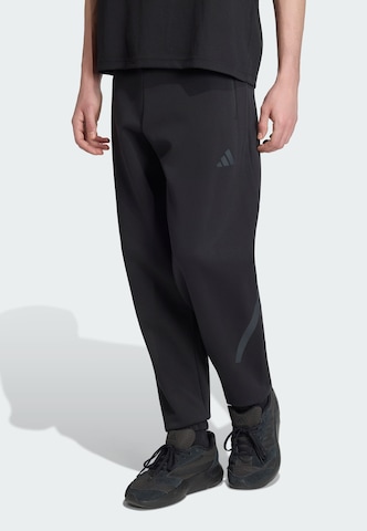melns ADIDAS SPORTSWEAR Pakapēniski sašaurināts piegriezums Sporta bikses 'Z.N.E.': no priekšpuses