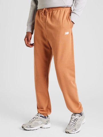 Effilé Pantalon new balance en marron : devant