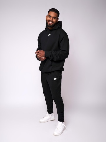 Pull-over 'Essential Oversized Hoodie' Fortex Fitness en noir