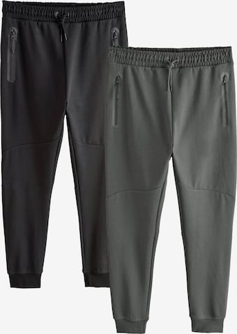 Next Tapered Housut värissä harmaa: etupuoli