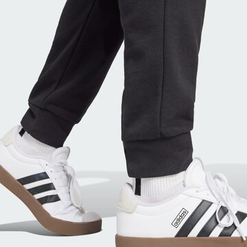 ADIDAS SPORTSWEAR Tapered Sports trousers 'FEELCOZY' in Black
