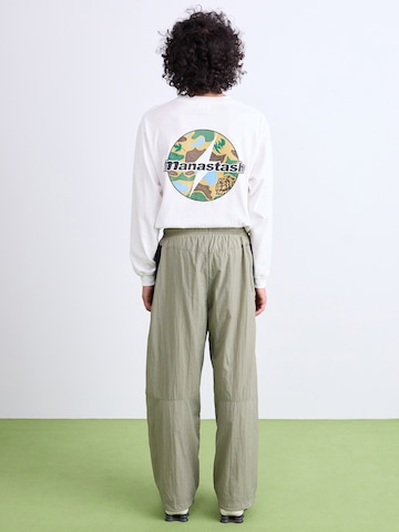Largi Pantaloni 'AIR' de la Nike Sportswear pe verde