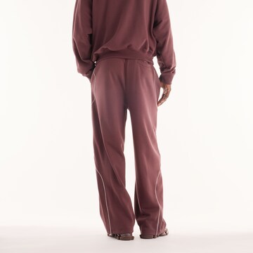 Wide leg Pantaloni 'Trackside French Terry Pant' di new balance in rosso