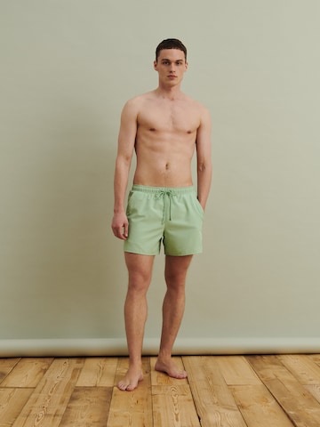 DAN FOX APPAREL Regular Swimming shorts 'Yigit' in Green: front