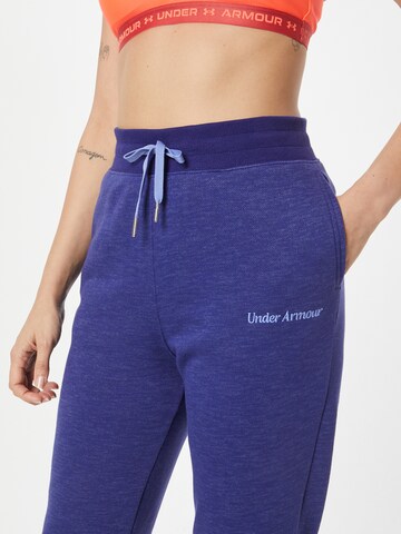 UNDER ARMOUR - Tapered Calças de desporto em azul