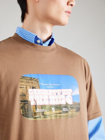 Carhartt WIP - Camiseta 'Greatest Flicks' en marrón