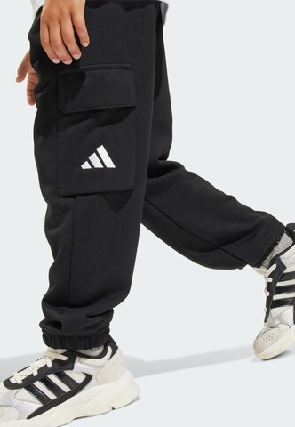 ADIDAS SPORTSWEAR Tapered Παντελόνι φόρμας 'Essentials' σε μαύρο