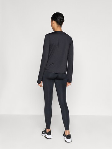 NIKE Skinny Sportnadrágok '365' - fekete