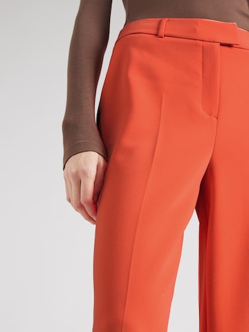 COMMA - Perna larga Calças em laranja