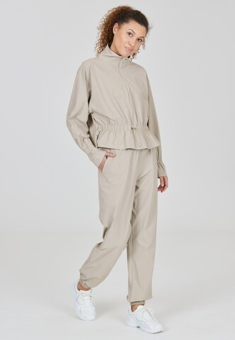 Athlecia Tapered Sports trousers 'Hero' in Beige