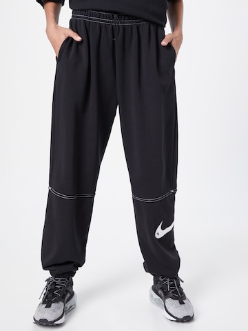 Nike Sportswear Tapered Pants in Black: front