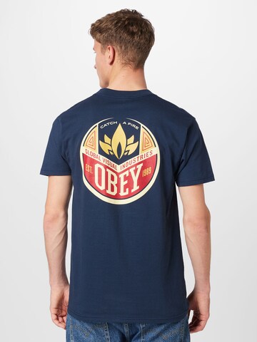 Obey T-Shirt  'CATCH A FIRE' in Blau