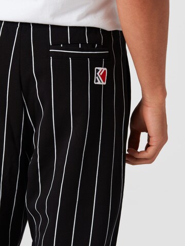 Karl Kani Tapered Hose in Schwarz