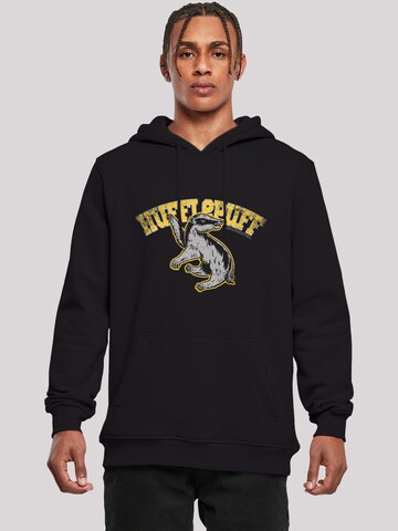 F4NT4STIC Sweatshirt 'Harry Potter Hufflepuff Sport Emblem' in Zwart: voorkant