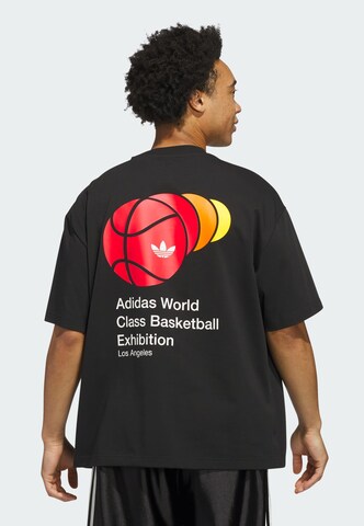 T-Shirt 'Weltklasse' ADIDAS ORIGINALS en noir : devant