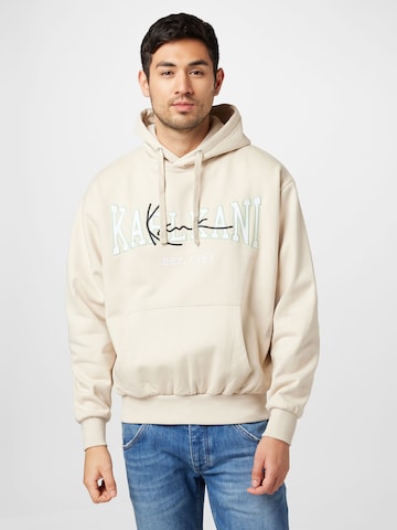 Karl KaniSweater majica - bež boja: prednji dio