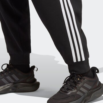 ADIDAS SPORTSWEAR Tapered Urheiluhousut 'Future Icons 3-Stripes  ' värissä musta