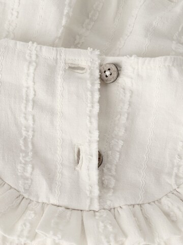 Tutina / body per bambino di Lil'Atelier in beige
