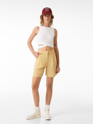 Bershka Regular Trousers in Yellow