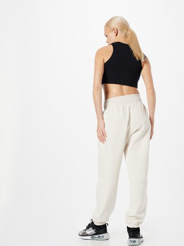 Nike Sportswear Zúžený Kalhoty 'PHOENIX FLEECE' – bílá