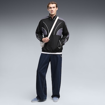 PUMA Sportjacke 'T7' in Schwarz