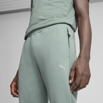 PUMA Slim fit Sports trousers 'Evostripe' in Green