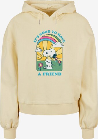 Merchcode Sweatshirt 'Peanuts - It's Good To Have A Friend' in Geel: voorkant