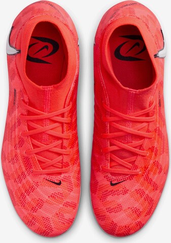 Chaussure de foot 'Phantom Luna FG' NIKE en rouge