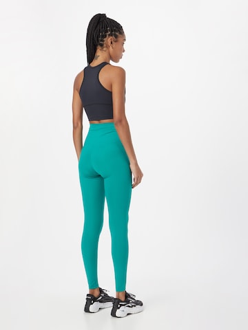 Skinny Pantaloni sport de la Girlfriend Collective pe verde