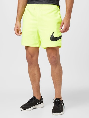 Nike Sportswear Regular Pants in Yellow: front
