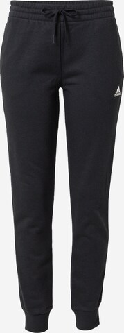 ADIDAS SPORTSWEAR Tapered Workout Pants 'Essentials Fleece Logo' in Black: front