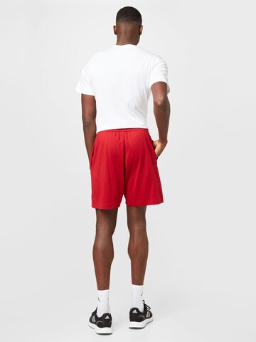 ADIDAS SPORTSWEAR - Regular Calças de desporto 'Donovan Mitchell' em vermelho