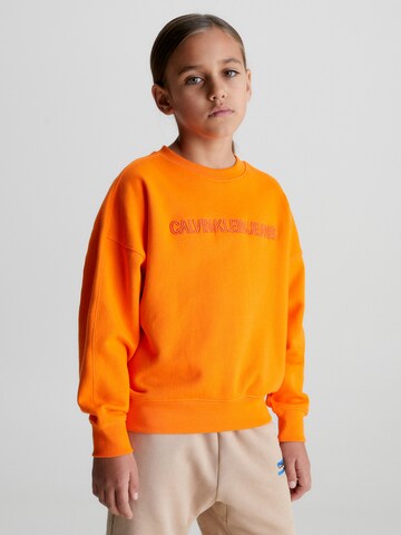Calvin Klein Jeans Mikina – oranžová: přední strana