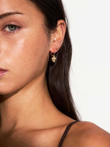 Boucles d'oreilles Bershka en or : devant