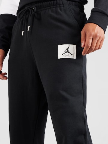 Tapered Pantaloni 'ESS' de la Jordan pe negru