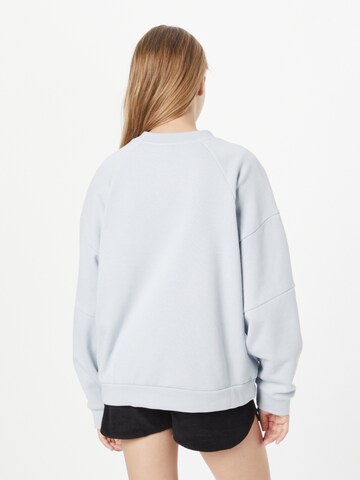 Hurley Sport sweatshirt 'WAVE' i blå