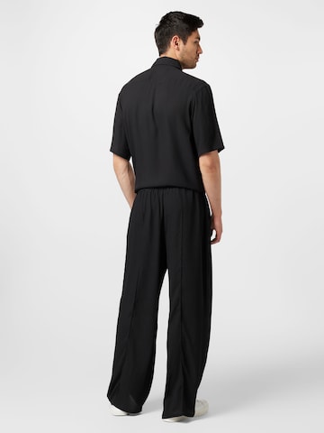 Wide Leg Pantalon à plis Han Kjøbenhavn en noir