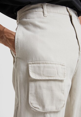 Karl Kani Regular Cargo trousers in Beige