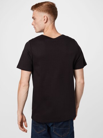 Tricou de la NU-IN pe negru