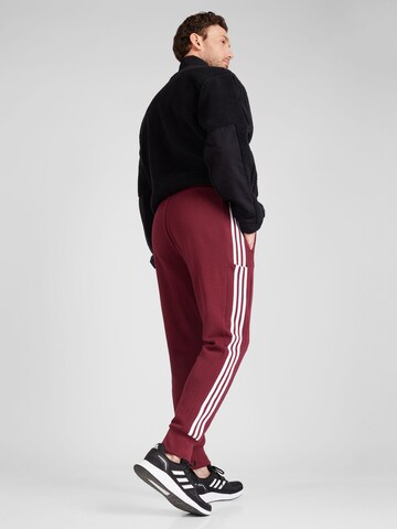ADIDAS SPORTSWEAR Tapered Workout Pants 'Essentials' in Red