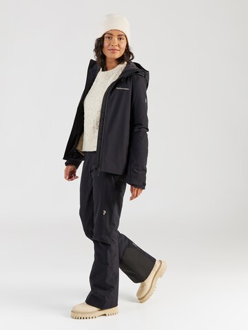 PEAK PERFORMANCE Bootcut Sportbyxa 'Insulated' i svart