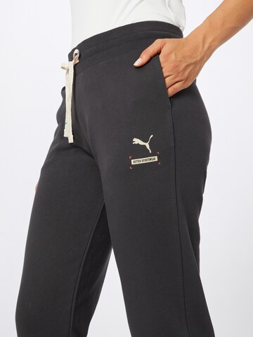 PUMA Tapered Sportbroek in Zwart