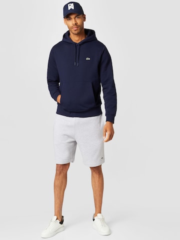 LACOSTE Sweatshirt i blå