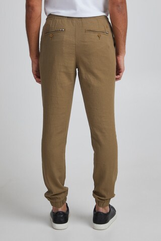 Slimfit Pantaloni 'Oeyvind' di 11 Project in marrone