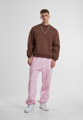 Effilé Pantalon 'Fluffy' Urban Classics en rose