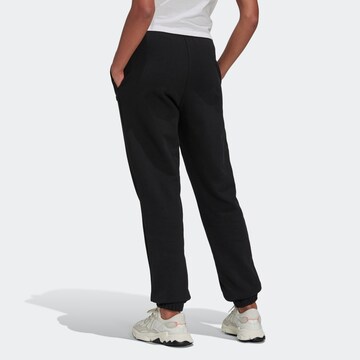 Tapered Pantaloni di ADIDAS ORIGINALS in nero